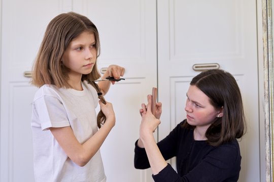 Girl Child Cuts Her Own Hair With Scissors, Older Sister Teenager Makes Videos On Smartphone