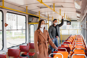 Fototapeta premium Passengers on public transport during the coronavirus pandemic keep their distance from each other. Protection and prevention covid 19
