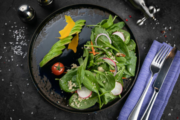 A fresh, healthy salad with zoodles zucchini noodles, baby tomatoes, avocado