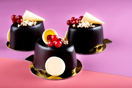 Dark chocolate dessert with cranberry and white chocolate. Minimalist conceptual design, flat lay