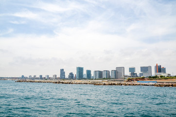 View from the sea in Spanish coastline and city of Barcelona with new architecture and modern buildings.