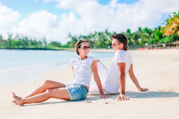 Young couple on white beach during summer vacation.