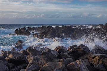 Lava stones on the beach of Piscinas Naturais Biscoitos. Atlantic Ocean. Terceira Azores, Portugal.