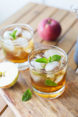 Close up glass with apple juice and mint