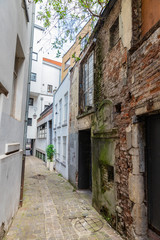 Old buildings and narrow street   in Caen, Normandy, France