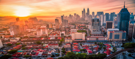 Cityscape of Kuala lumpur city skyline view on the roof top of hotel at sunrise in Malaysia.