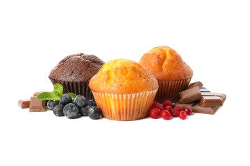 Muffins, berries and chocolate isolated on white background