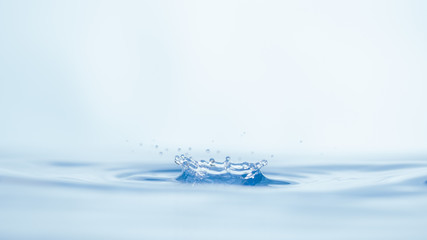 Naklejka na ściany i meble Drops of water on a blue background.