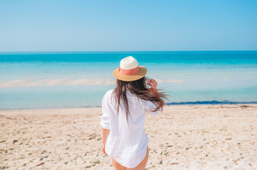 Woman laying on the beach enjoying summer holidays