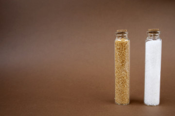 Sugar and salt for bathroom. Copy space. Place for text and design. Brown background.