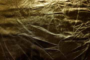 Crumpled golden texture, crumpled golden abstract background