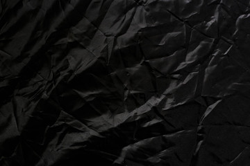 Crumpled black texture, crumpled black fabric, abstract background