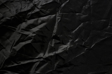 Crumpled black texture, crumpled black fabric, abstract background
