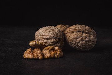 three nuts on a black background