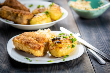 Cutlet cordon bleu and hasselback potatoes
