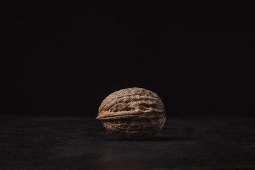 one nut on a black background
