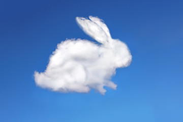  rabbit cloud in the blue sky, background of blue sky and fluffy white easter bunny made of cloud Greeting card from fluffy Easter, blue background with copy space. Congratulation Happy Easter card...