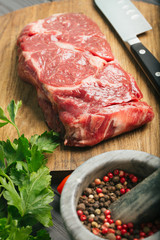 Raw steak, marbled beef, meat, dark background.