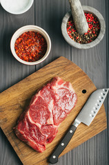 Raw steak, marbled beef, meat, dark background.