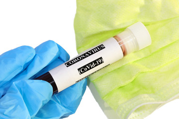 plastic test tube with blood and onthe blue glove