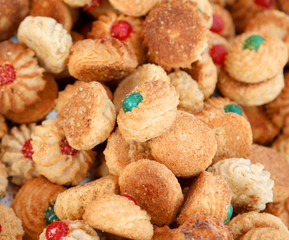 background of many mouth-watering pastries made with almonds and