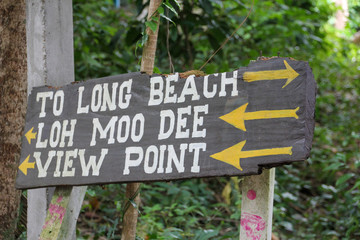 Wooden sign indicating the long beach of the Phi Phi Islands