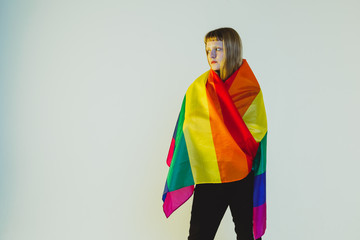 Beautiful lesbian girl wrapped in a rainbow flag