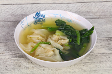Asian traditional Wonton soup with herbs