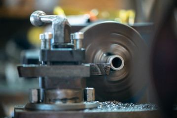 Lathe machine close up abstract background.