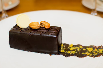 Selection of desserts: amandine, meringue with chocolate and strawberries, caramel cake