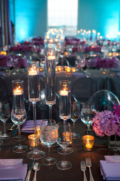 High angle vertical empty shot of table setting at a formal party at dusk.