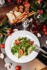 Caesar salad with chicken, cherry tomatoes, lettuce