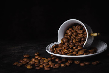 coffee beans in a coffee cup. On a black background
