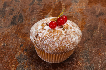 Sweet tasty muffin with red currants
