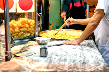 Fried flour snack called "Pa Tong Go", popular food. Street food, Yaowarat road at night, a popular place for travelers Bangkok Thailand.
