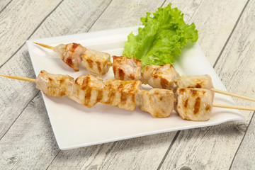 Grilled pork skewer served salad