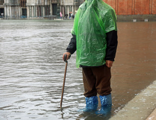 elderly gentleman with walking stick in Saint Mark square in Ven