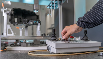 quality engineer controls an instrument for 3D measurement of plastic castings in the automotive industry