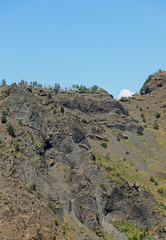 vegetation and small shrubs on the slopes of the extinct volcano