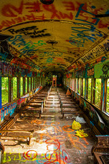 An abandoned train with graffiti