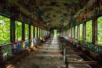 An abandoned train with graffiti