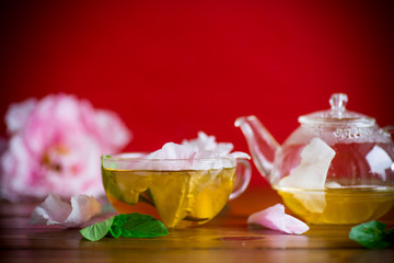 summer flower tea from rose petals in a glass cup