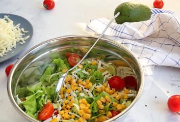 Dietary vegetable salad in a bowl on a white background