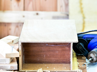 close up hands with white protective safety glove of  carpenter working on the wood work and live streaming on social media