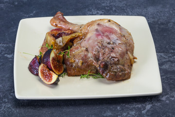 Roasted. duck. leg with plum and apple