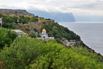 Naklejka premium Monastery on the slope by the sea