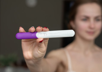 Happy Woman With Pregnancy Test