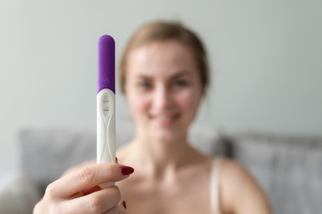 Happy Woman With Pregnancy Test