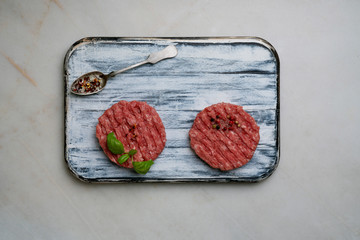 Raw Ground beef meat Burger steak cutlets with seasonings