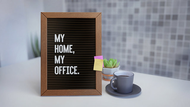 Letter Board with text message: My Home My Office. Inside a Modern House, on a Table, White Flat Surface